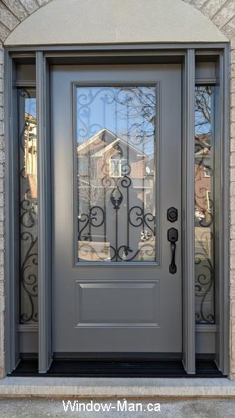 Front door. Two sidelights. Wrougt iron glass inserts Liverpool design. Slate color